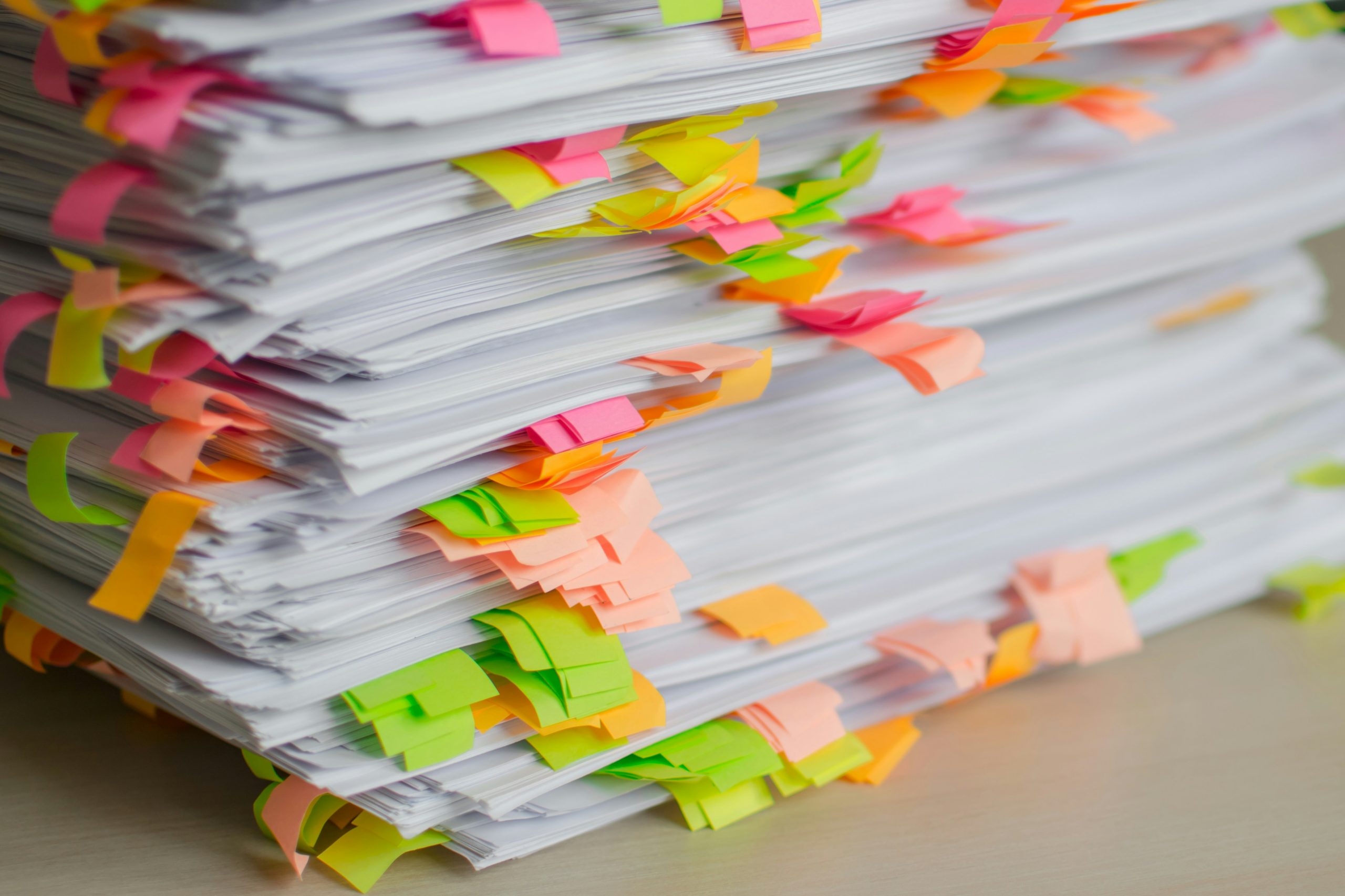 pile of documents that need to be summarized